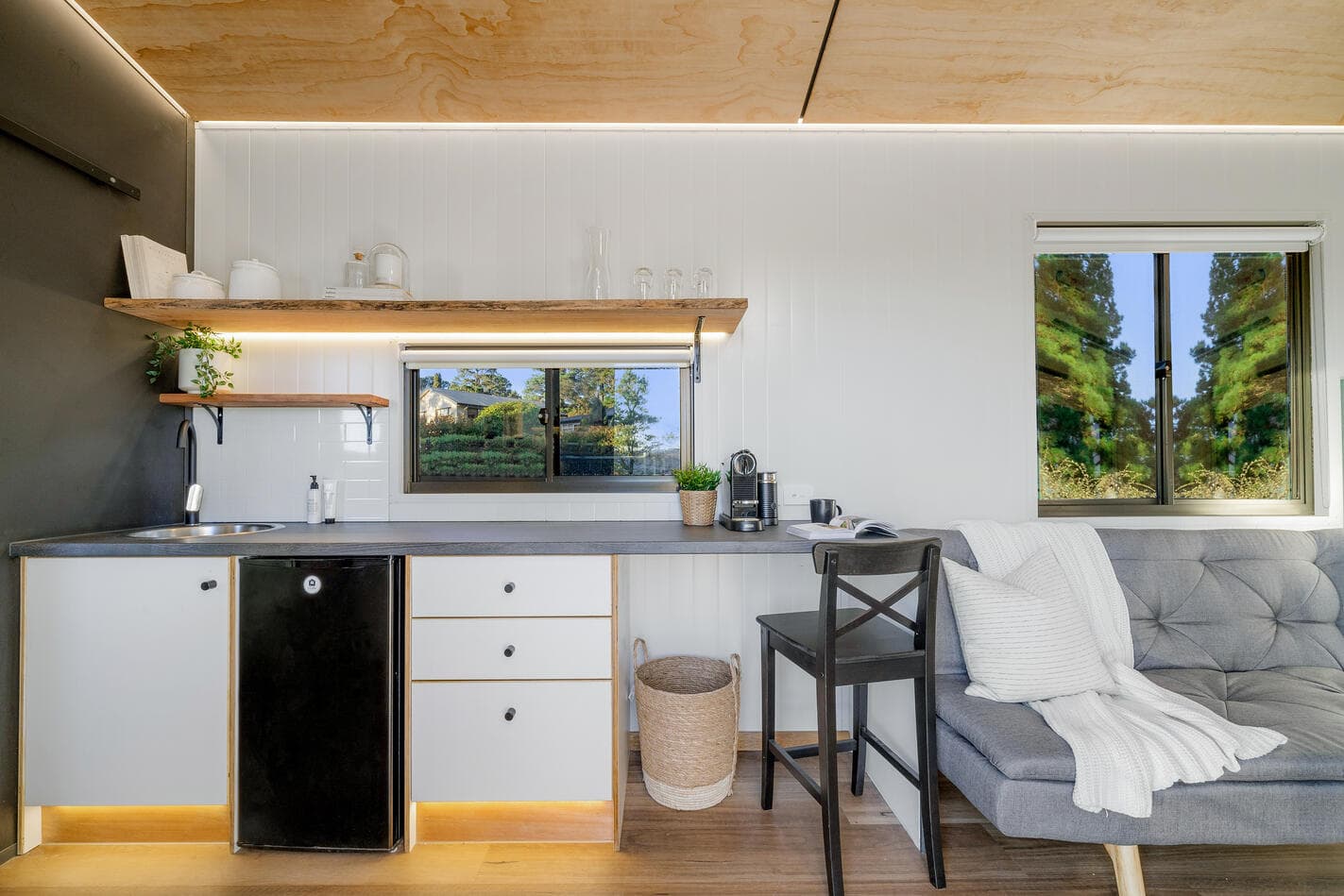 Inside The Roo: full kitchen, split-system, sliding doors to the deck
